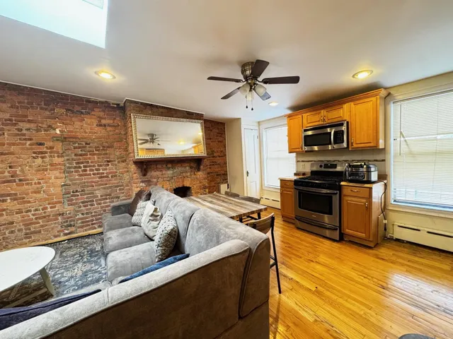 a kitchen with stainless steel appliances granite countertop a sink a stove top oven a granite counter space and cabinets