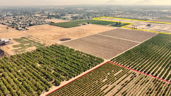 an outdoor space with wooden floor and pool view