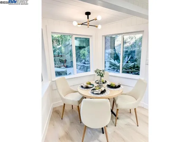 a view of a dining room with furniture window and outside view