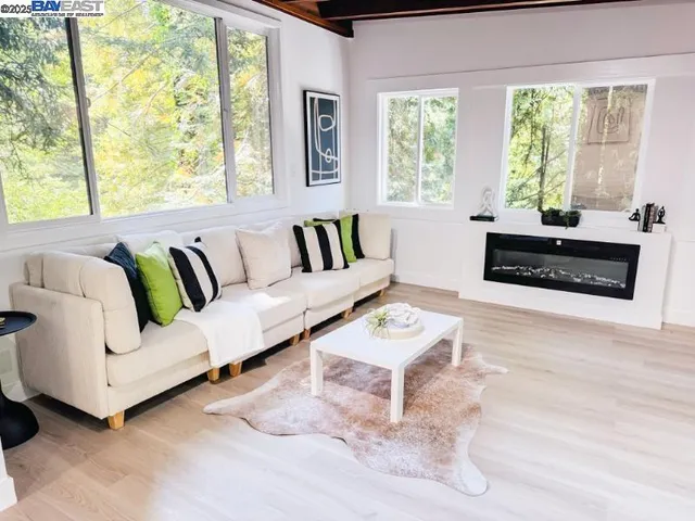 a living room with furniture and a large window