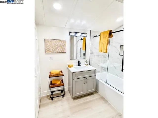 a view of a bedroom with a cabinet and closet