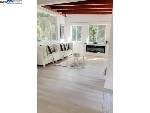 a view of a dining room with furniture and window