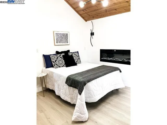 a view of balcony with wooden floor and outdoor seating