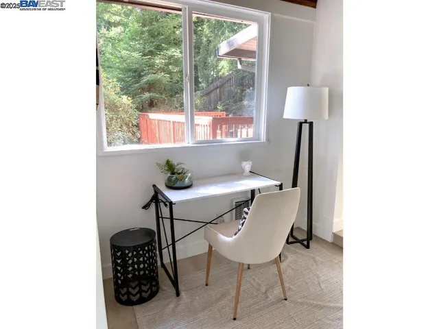 a balcony with table and chairs