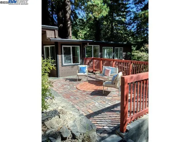 a view of balcony with wooden floor and outdoor seating