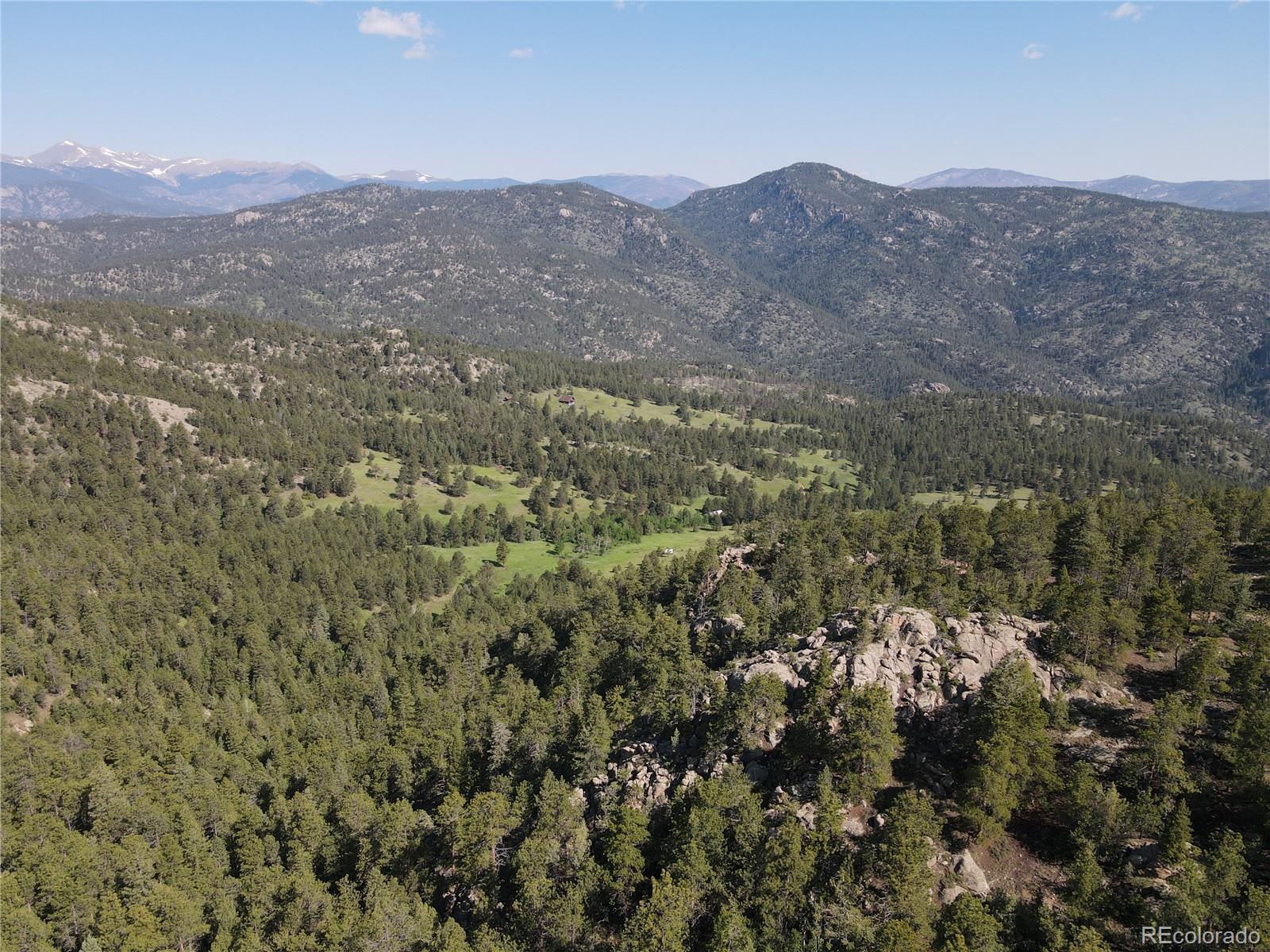591599 Soul Shine Road Drake, CO 80515 - Photo 13 of 50 an aerial view of residential house and green space