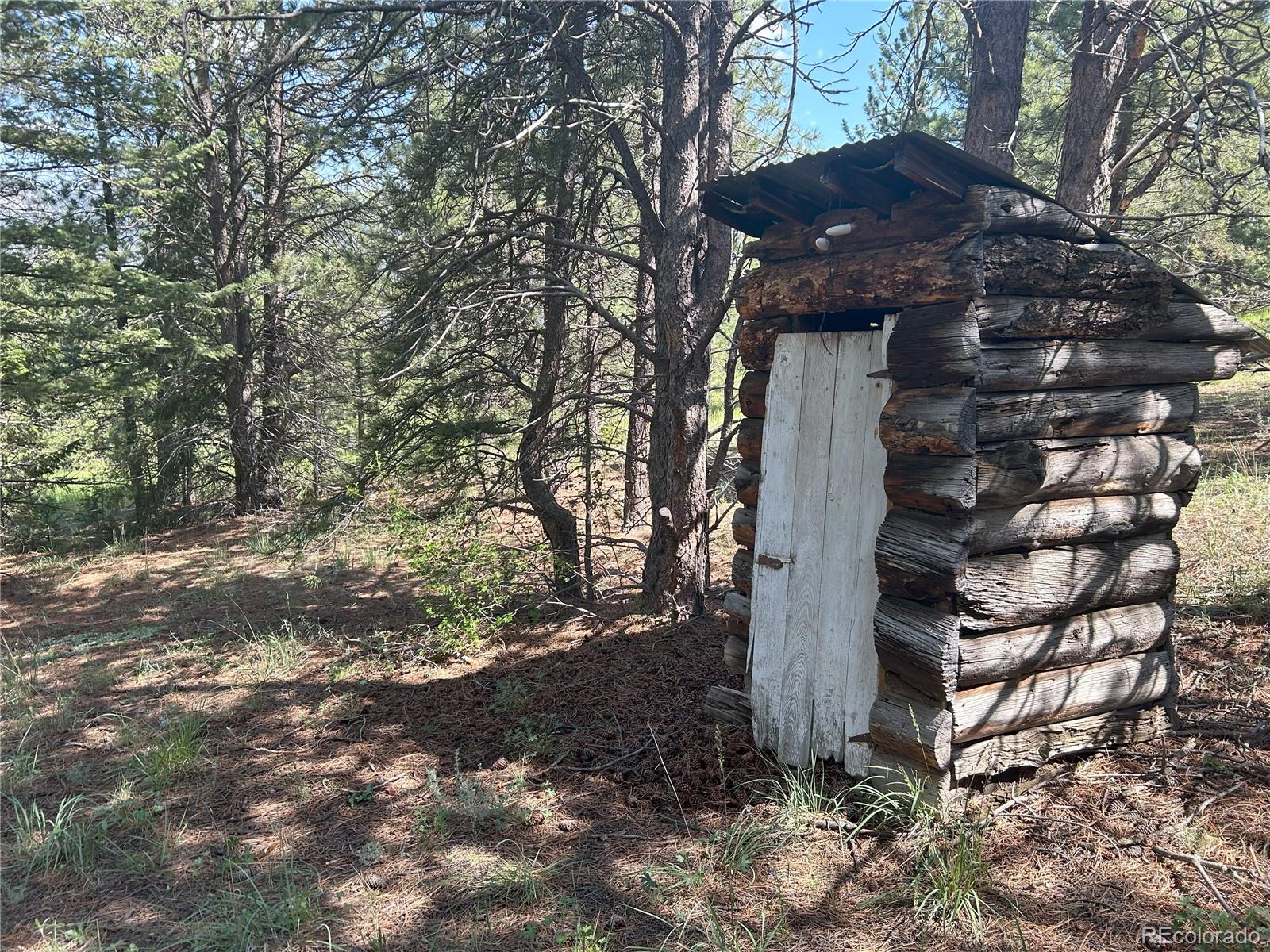 591599 Soul Shine Road Drake, CO 80515 - Photo 47 of 50 a view of a house with a tree