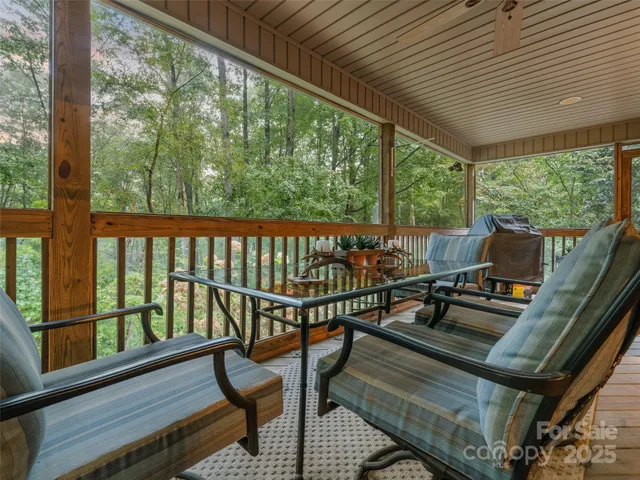 a view of a two chairs in the balcony