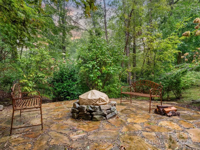a car parked in a backyard of a house