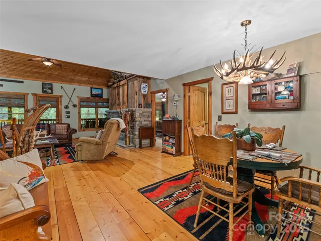a bed room with furniture and a chandelier