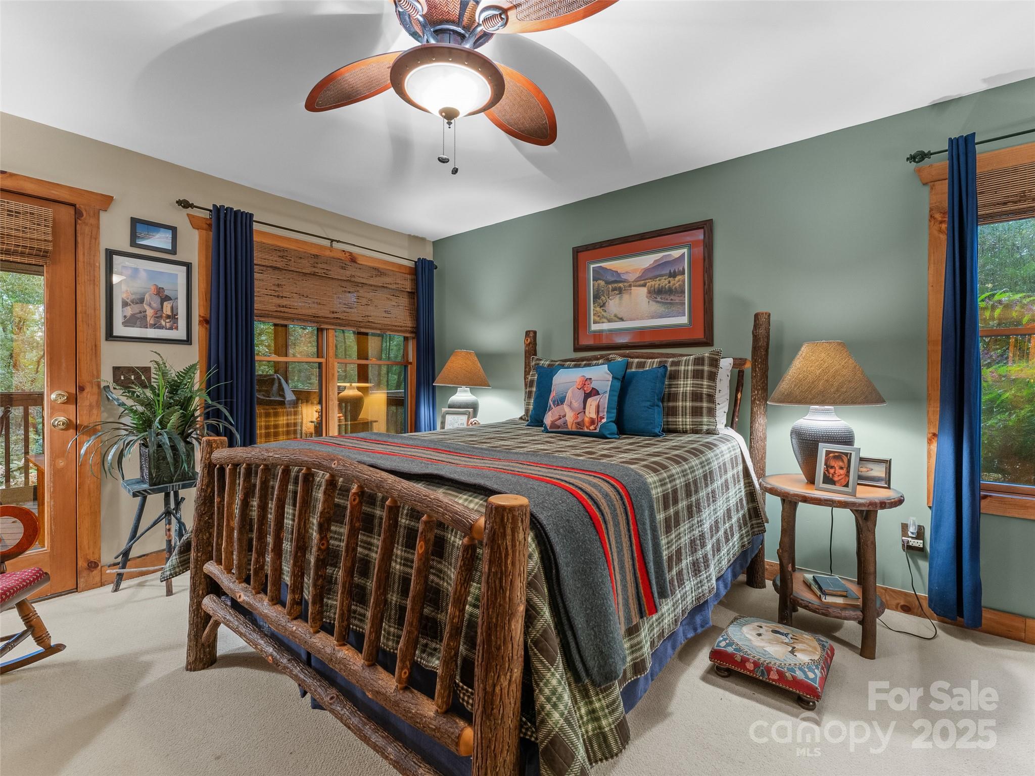 779 Thissa Way Brevard, NC 28712 - Photo 20 of 44 a bedroom with a bed and a chandelier