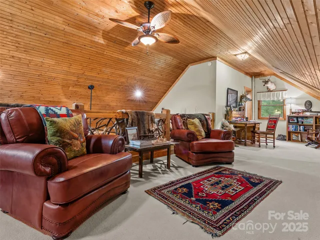 a living room with lots of furniture and a rug