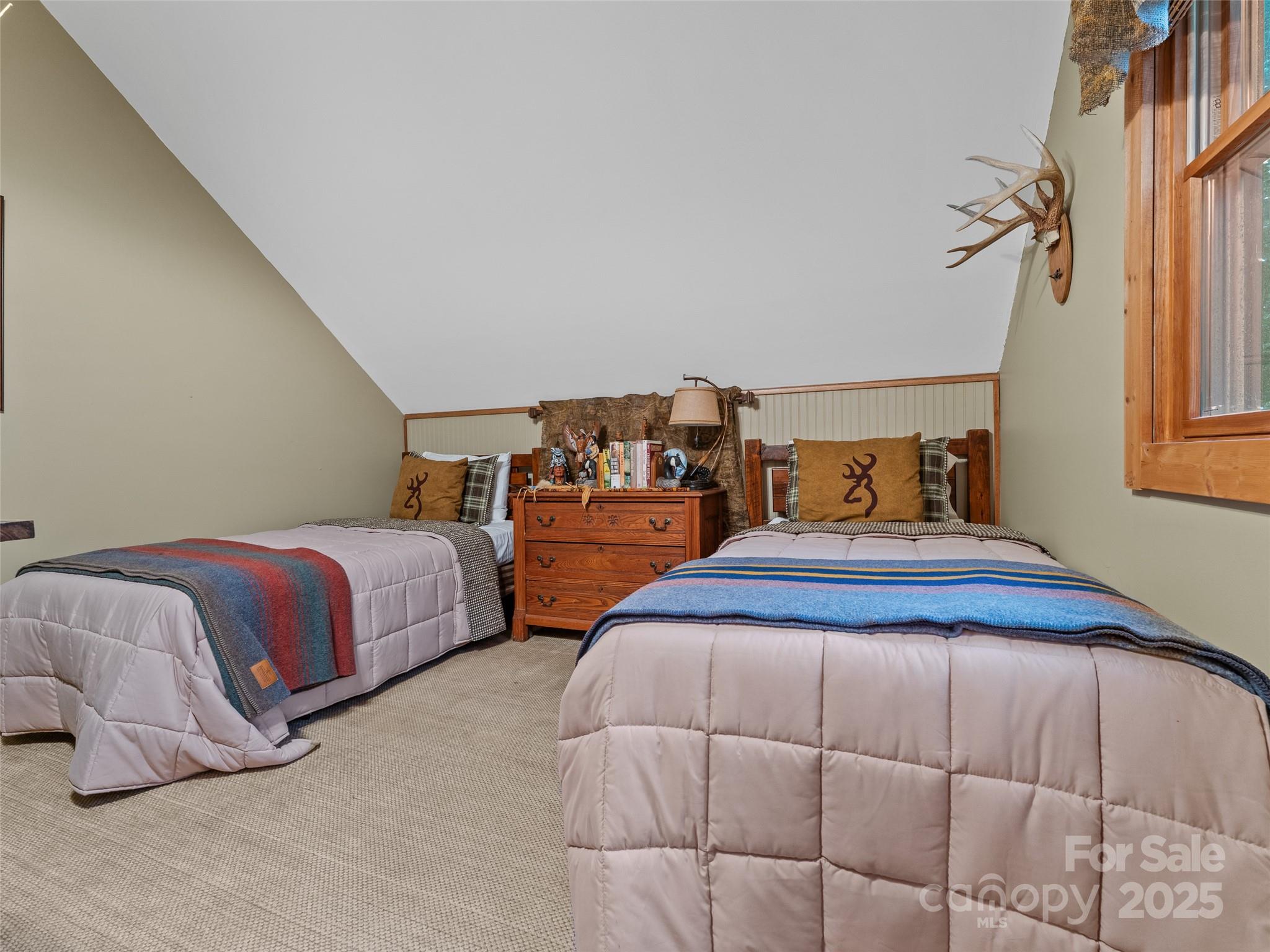 779 Thissa Way Brevard, NC 28712 - Photo 27 of 44 a bedroom with a bed and window