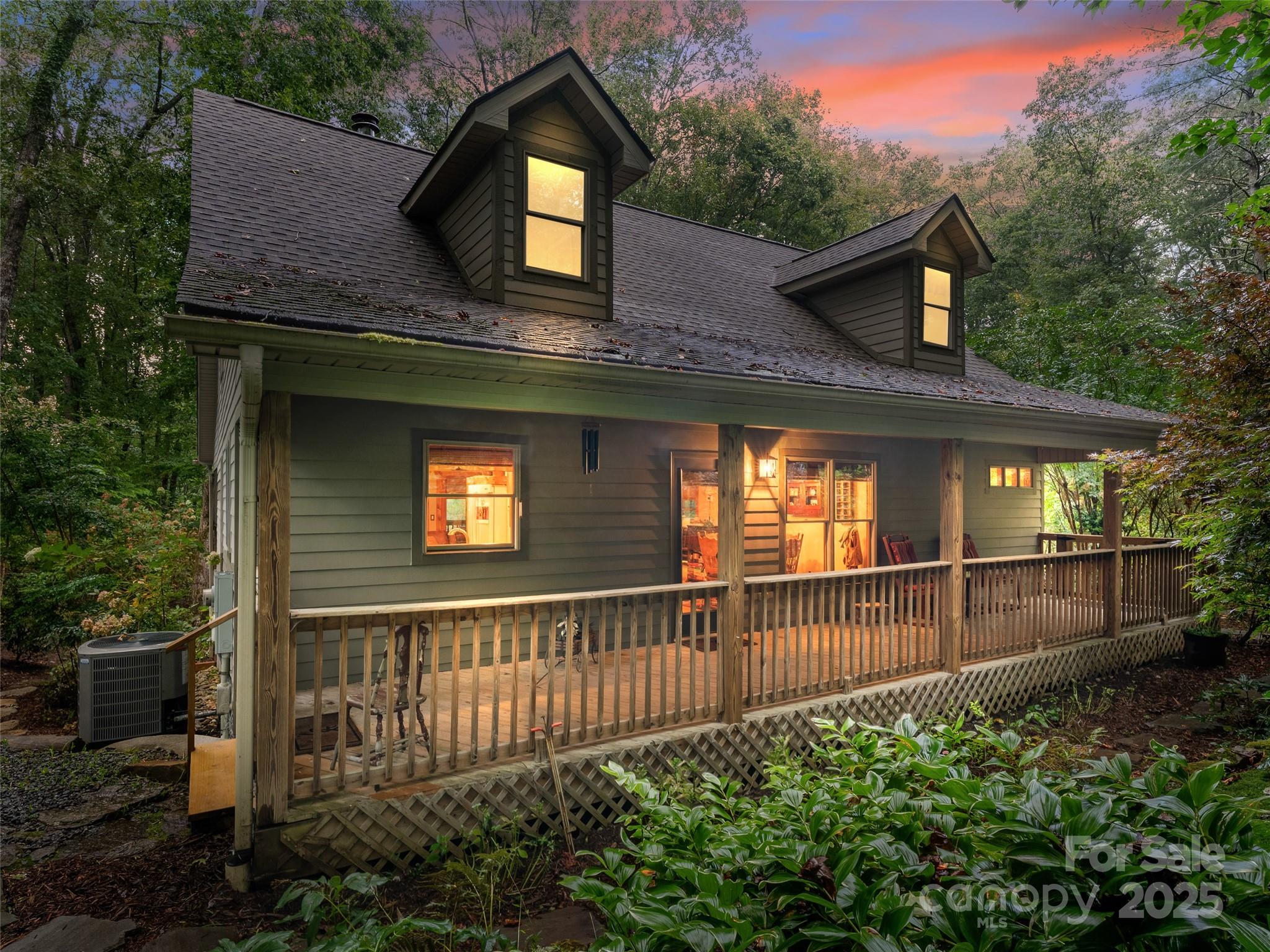 779 Thissa Way Brevard, NC 28712 - Photo 3 of 44 a view of a house with wooden fence