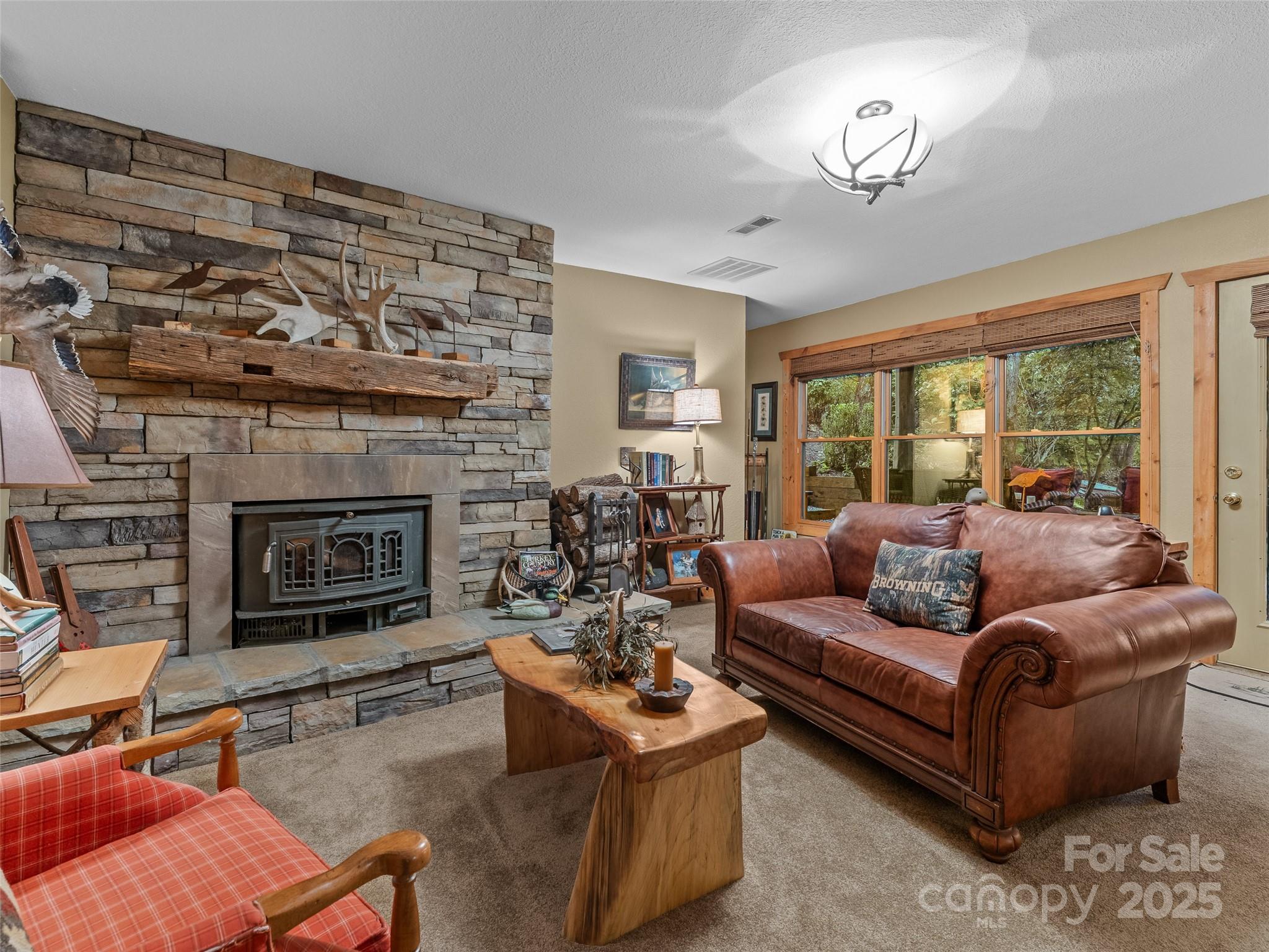779 Thissa Way Brevard, NC 28712 - Photo 31 of 44 a living room with furniture and a fireplace