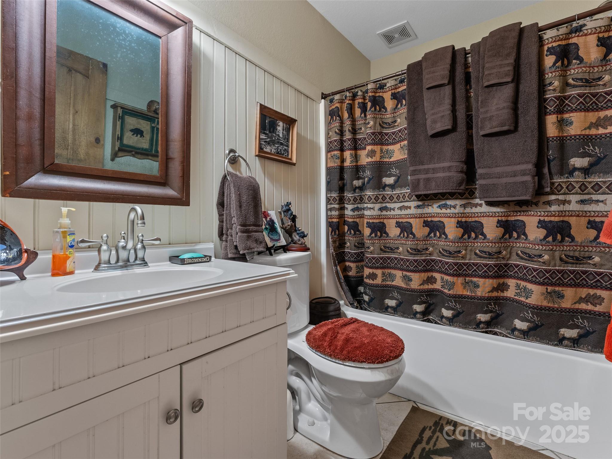 779 Thissa Way Brevard, NC 28712 - Photo 36 of 44 a bathroom with a toilet sink and mirror