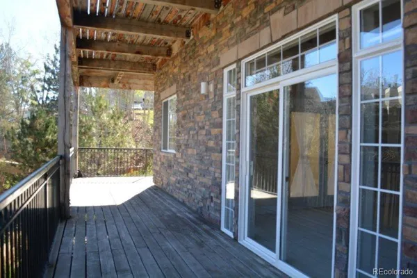 a view of balcony with wooden floor