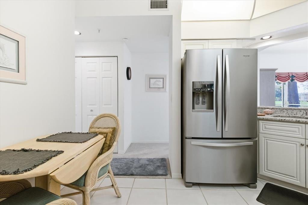 6640 Pineview Terrace, Unit 6640 Bradenton, FL 34203 - Photo 20 of 80 a kitchen with stainless steel appliances granite countertop a refrigerator and a stove