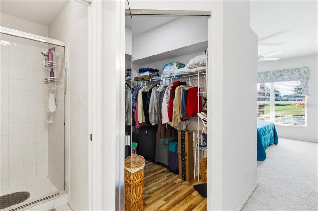 6640 Pineview Terrace, Unit 6640 Bradenton, FL 34203 - Photo 31 of 80 a view of walk in closet with clothes and shoes