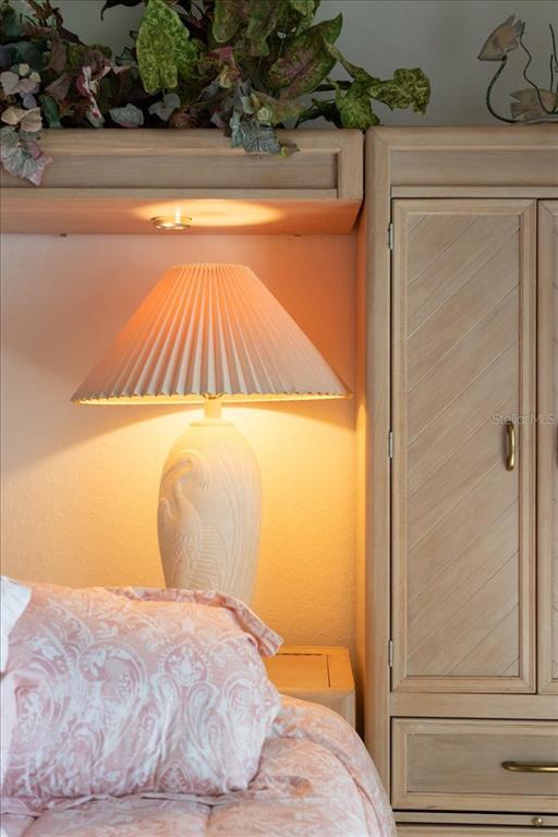 6640 Pineview Terrace, Unit 6640 Bradenton, FL 34203 - Photo 34 of 80 a bedroom with a bed and painting on the wall