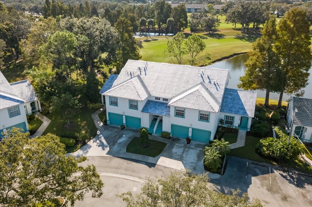 6640 Pineview Terrace, Unit 6640 Bradenton, FL 34203 - Photo 53 of 80 a view of a house with a garden