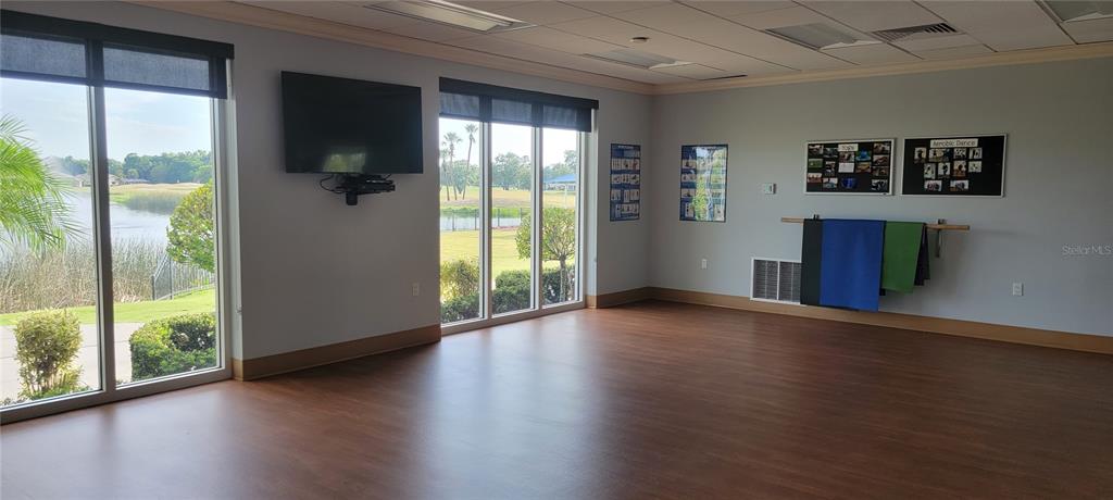 6640 Pineview Terrace, Unit 6640 Bradenton, FL 34203 - Photo 59 of 80 a view of an empty room with wooden floor and a window