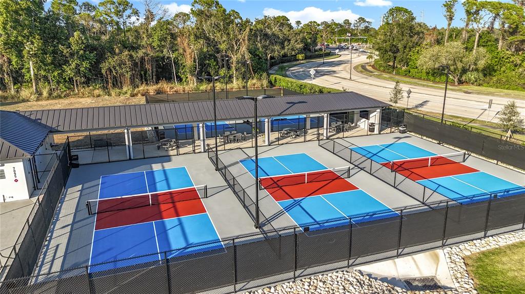 6640 Pineview Terrace, Unit 6640 Bradenton, FL 34203 - Photo 72 of 80 a view of a chairs and table in the patio