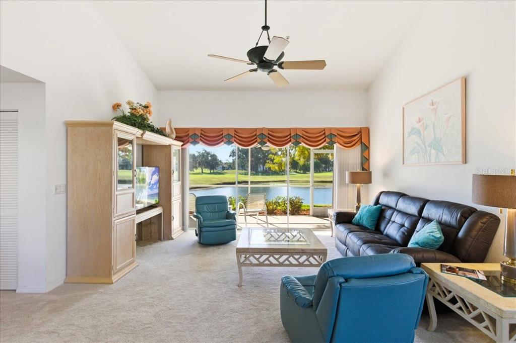 6640 Pineview Terrace, Unit 6640 Bradenton, FL 34203 - Photo 9 of 80 a living room with furniture and a large window
