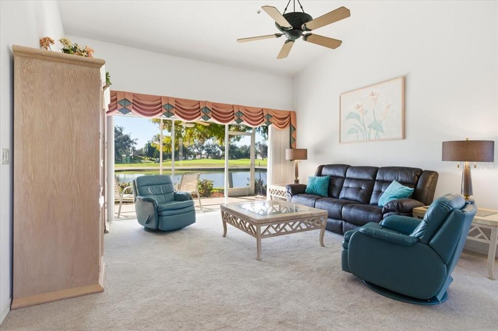 6640 Pineview Terrace, Unit 6640 Bradenton, FL 34203 - Photo 10 of 80 a living room with furniture and a window