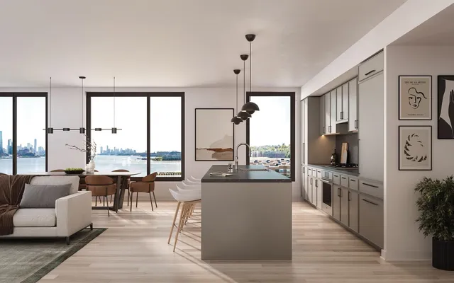 a living room with furniture a large window and appliances