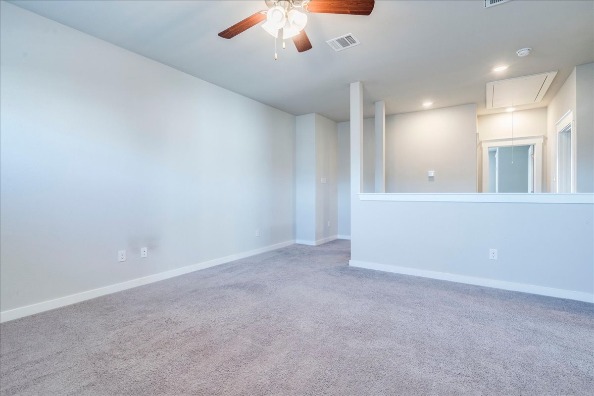 144 Threshing Road, Unit A Buda, TX 78610 - Photo 21 of 35 Second living area located at the top of the stairs.