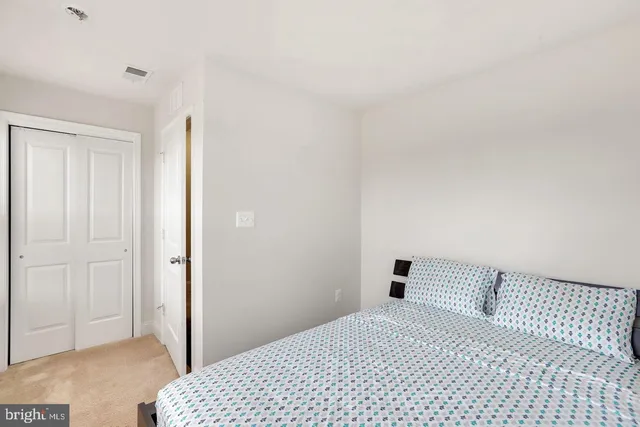 a bedroom with a bed and a cabinets