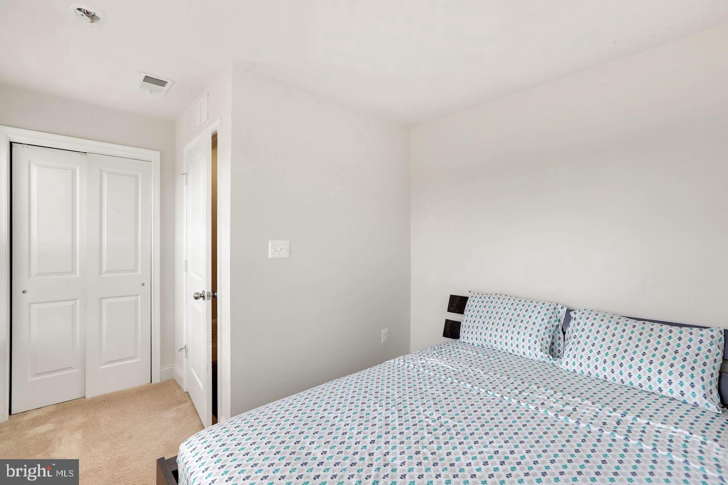 4600 Potomac Highlands Circle Triangle, VA 22172 - Photo 11 of 30 a bedroom with a bed and a cabinets