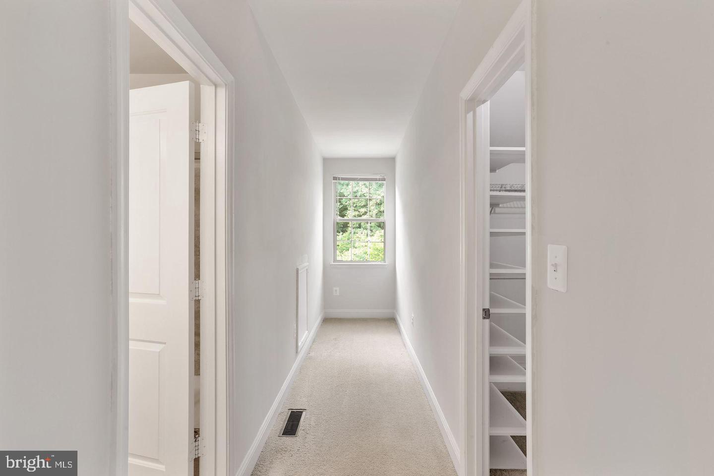 4600 Potomac Highlands Circle Triangle, VA 22172 - Photo 16 of 30 a view of a hallway with windows