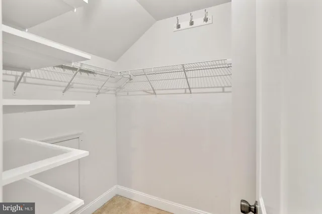 a view of a room with racks on the wall