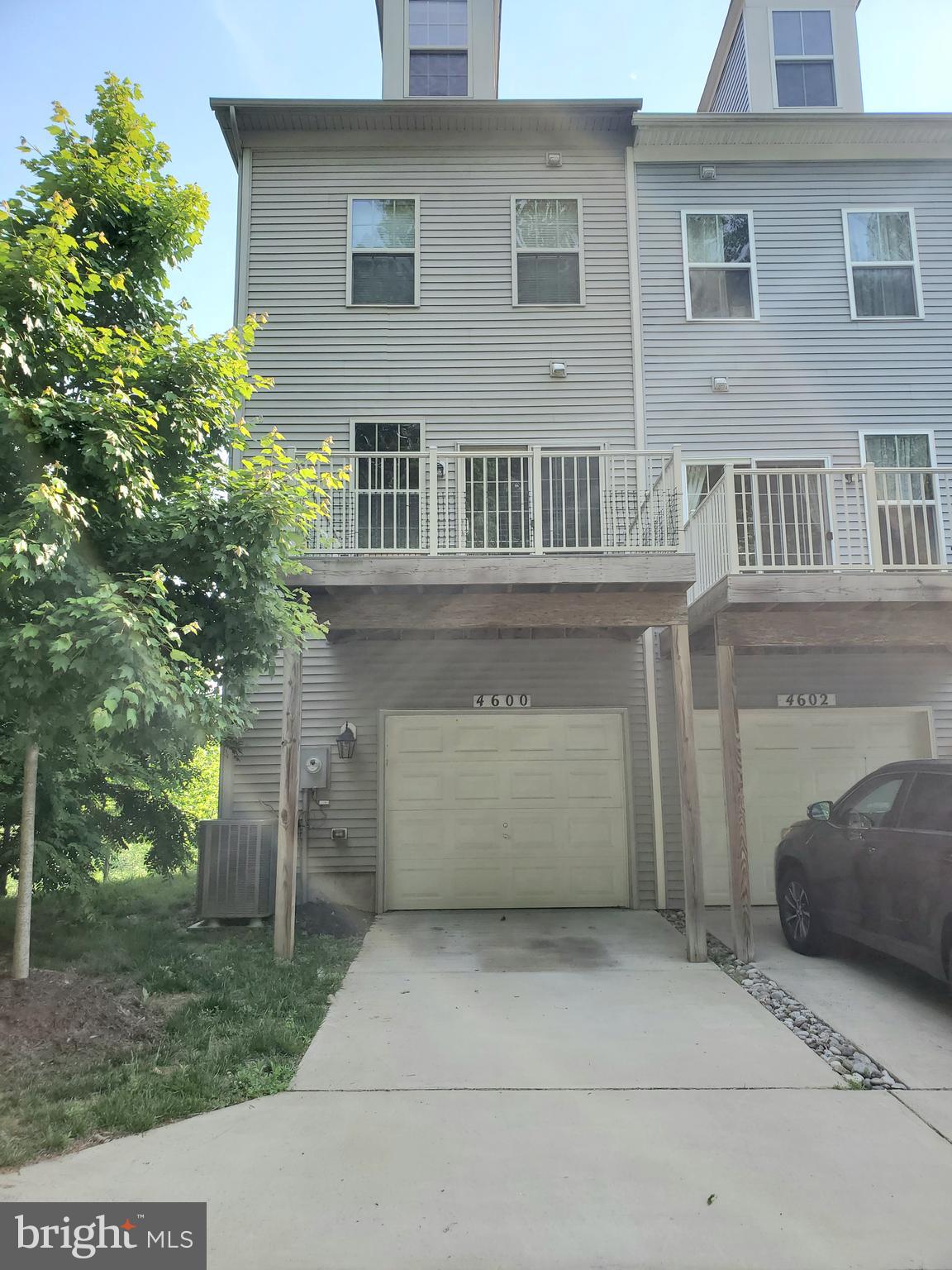 4600 Potomac Highlands Circle Triangle, VA 22172 - Photo 25 of 30 a front view of a house with a yard and garage
