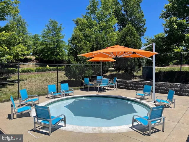 a view of outdoor kitchen with outdoor seating