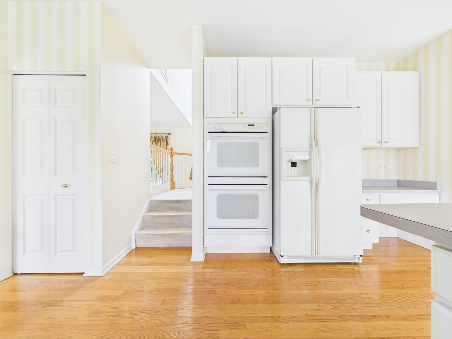 7486 Abbey Road Gurnee, IL 60031 - Photo 11 of 35 a view of a kitchen with white cabinets and refrigerator