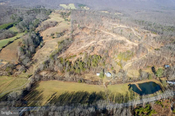 a aerial view of a house with a yard