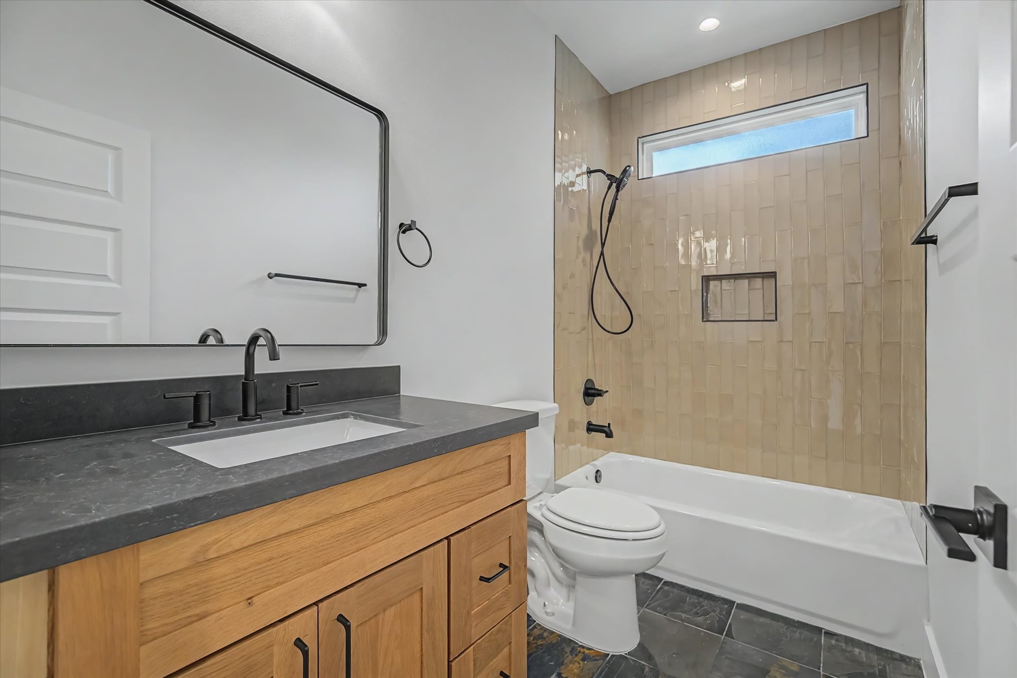 3806 Dreyfus Street Houston, TX 77021 - Photo 35 of 48 Secondary bathroom featuring a bathtub and shower combination.