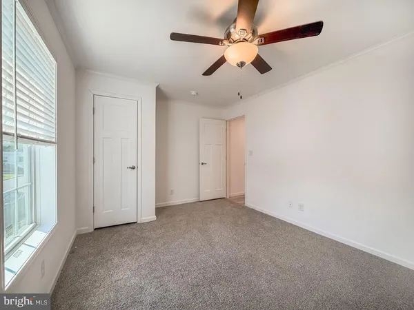 an empty room with fan