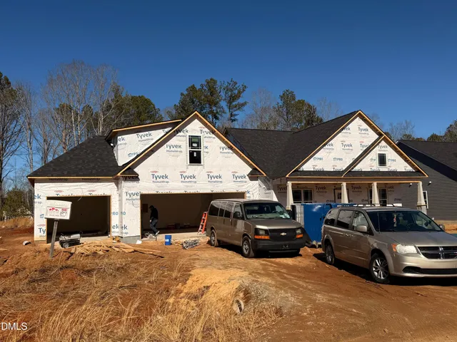 a view of a car parked in front of house