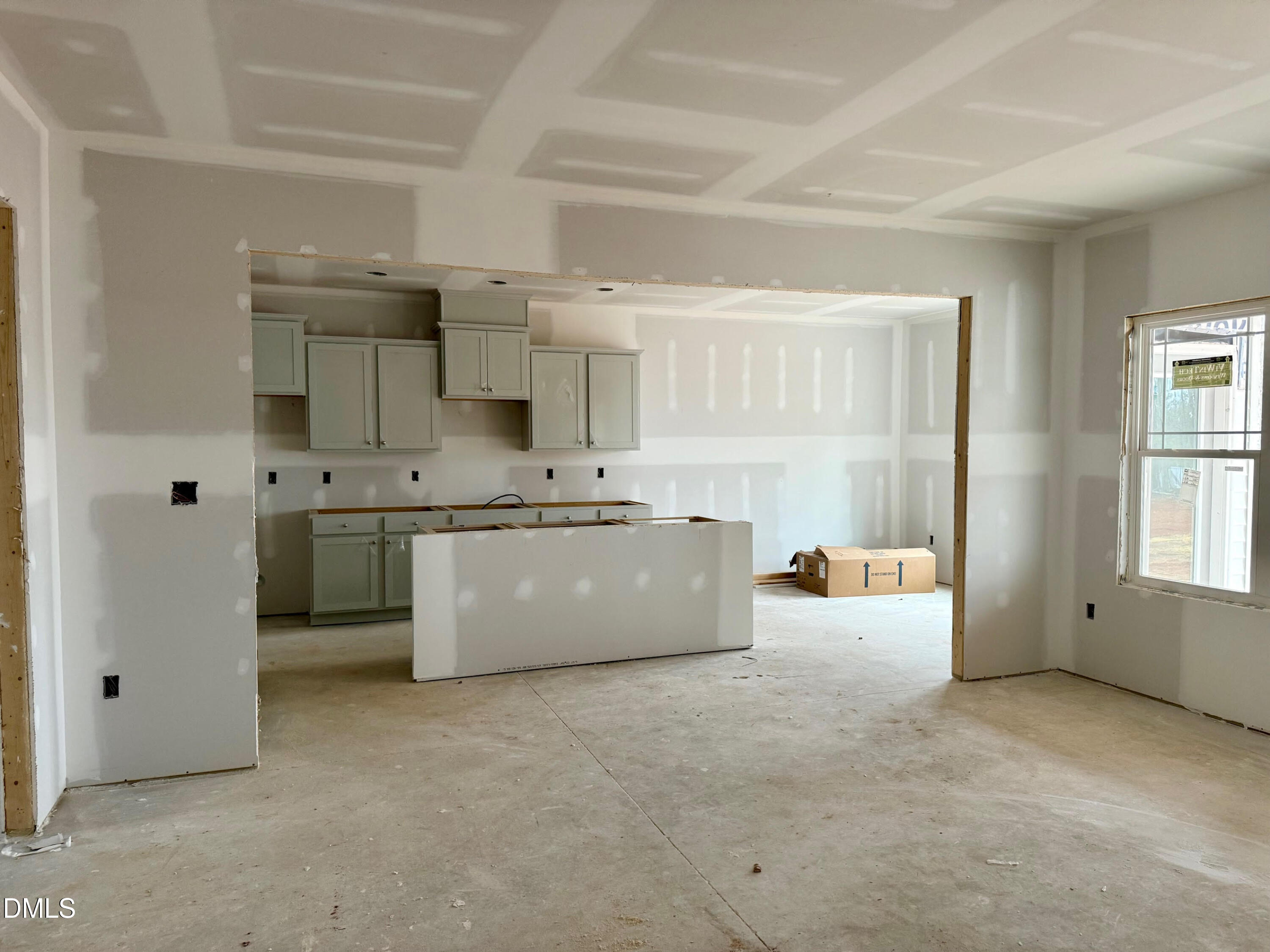 243 Seahawk Way Zebulon, NC 27597 - Photo 3 of 5 a large white kitchen with stainless steel appliances