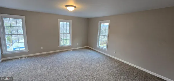 an empty room with windows