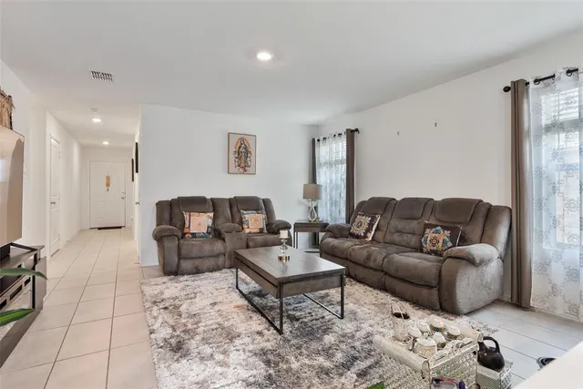 a living room with furniture and a couch