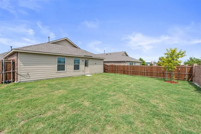 a backyard of a house with lots of green space