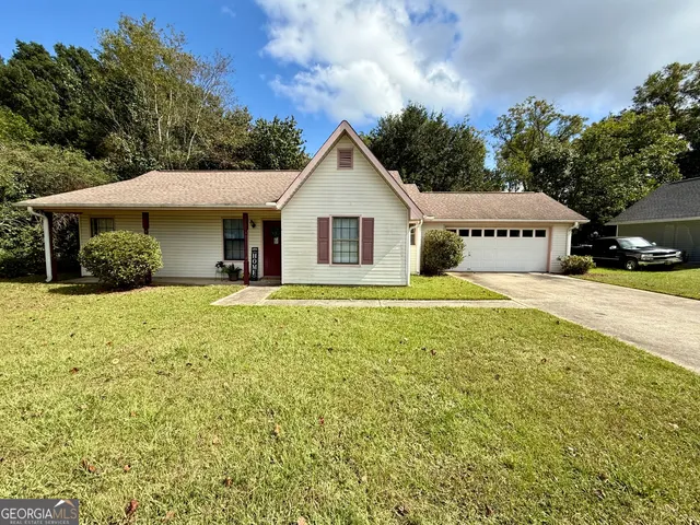 a house with trees in the background