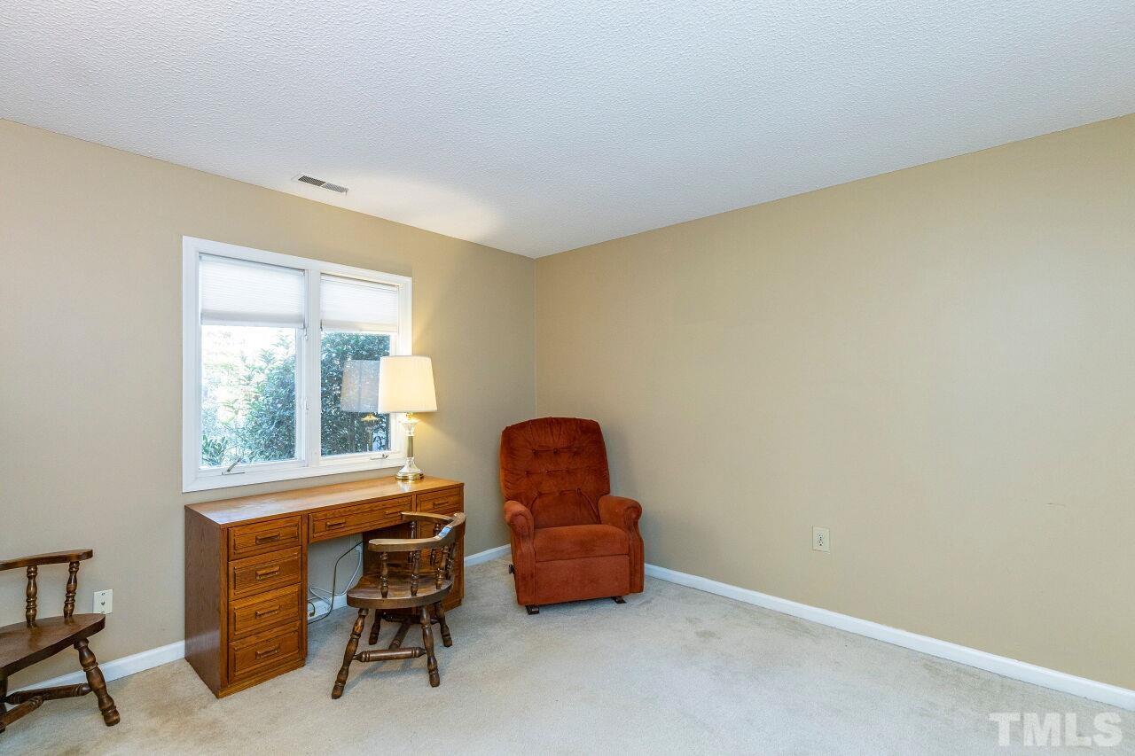 7902 Yester Court Raleigh, NC 27615 - Photo 22 of 30 a room with furniture and a window