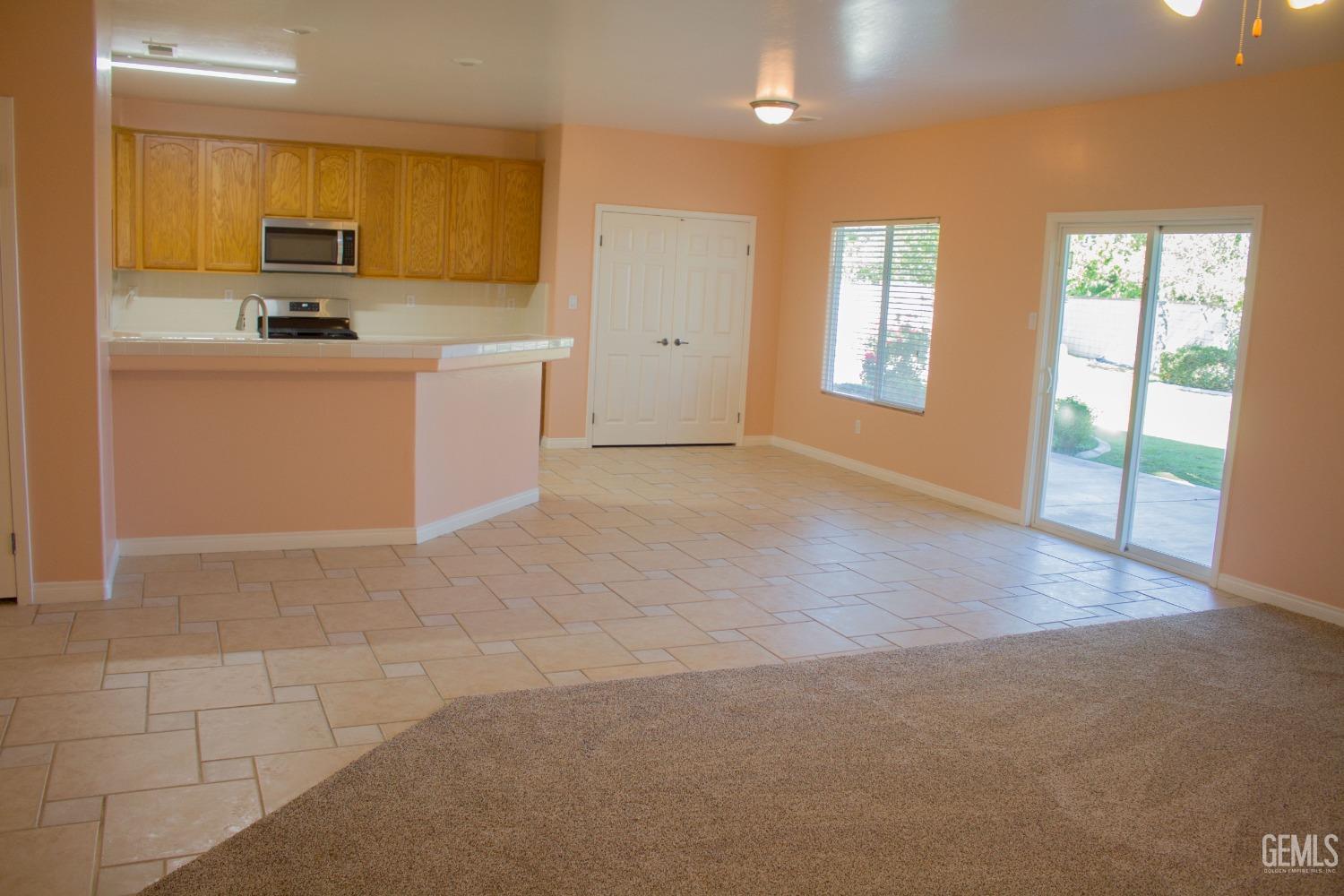 Undisclosed Address Bakersfield, CA 93312 - Photo 13 of 44 a kitchen with stainless steel appliances granite countertop a stove a sink and a refrigerator