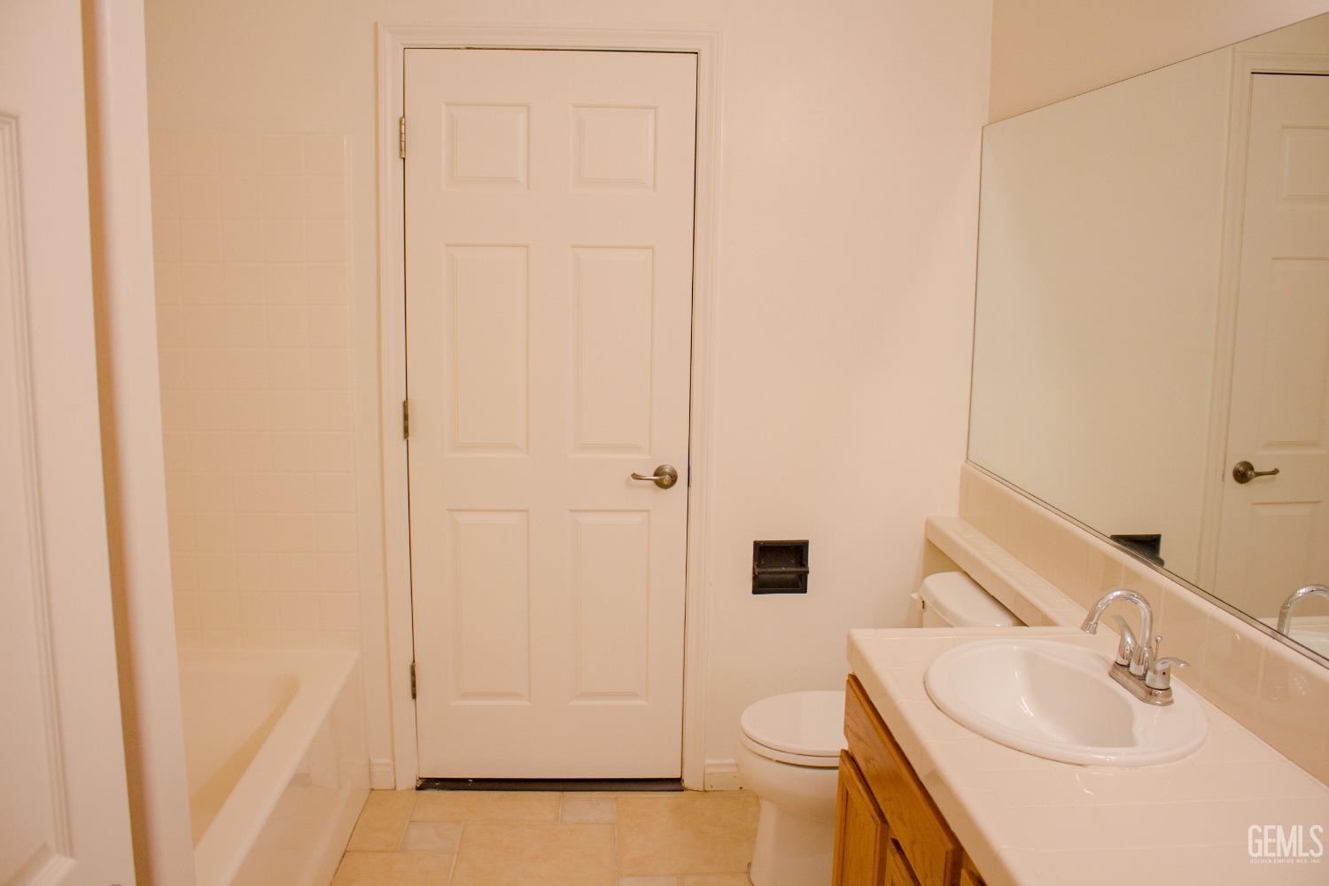 Undisclosed Address Bakersfield, CA 93312 - Photo 17 of 44 a bathroom with a sink and a mirror